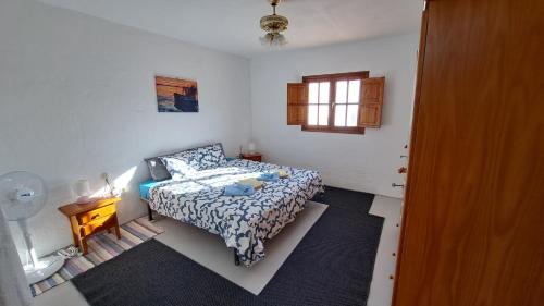 Ένα ή περισσότερα κρεβάτια σε δωμάτιο στο Captivating 2-Bedroom House 'Pajar' Finca Vistamar