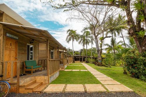 a porch of a house with a green bench at Rancho Estero in Santa Catalina