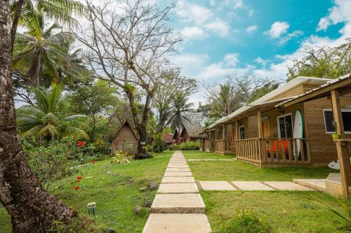 a house with a pathway leading to a yard at Rancho Estero in Santa Catalina