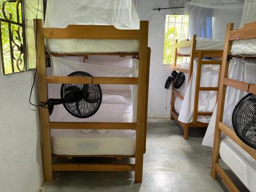 a group of bunk beds in a room at Casa Danam in Santa Marta