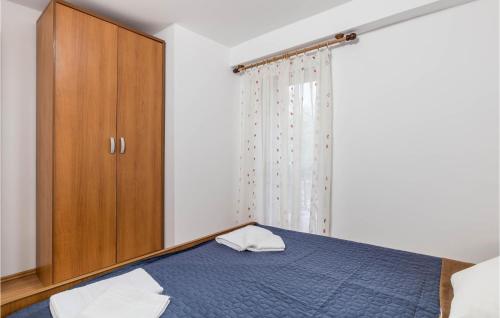 Postel nebo postele na pokoji v ubytování 2 Bedroom Cozy Home In Jurdani