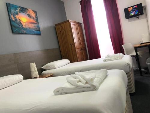 Katil atau katil-katil dalam bilik di Crystal Beach Hotel