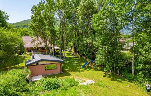 an overhead view of a small house with a playground at Pet Friendly Home In Mazin With Sauna in Mazin