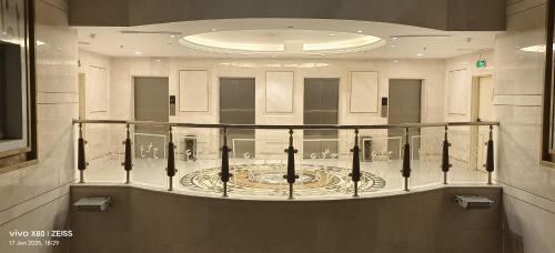 a large room with a circle in the middle at Maidan Al Bait in Makkah