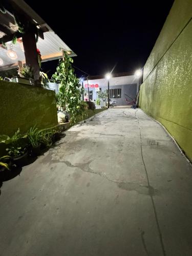 an empty parking lot at night with lights on at Casa da Vó Gera in Foz do Iguaçu