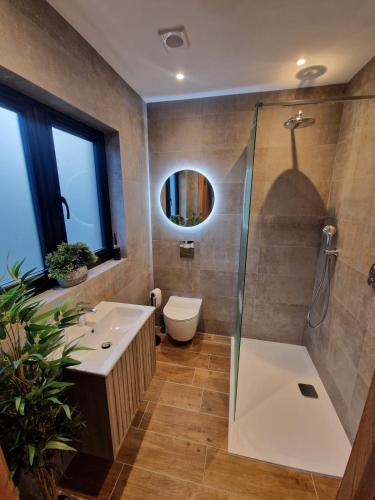 a bathroom with a shower and a sink at Cedar Lodge in Bowness-on-Windermere