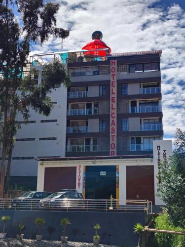 a building with a red dome on top of it at Hotel El Castor in Huaraz