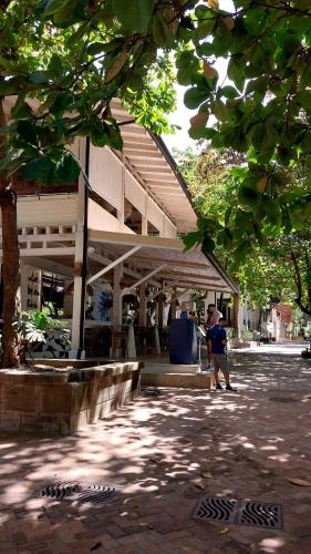 a person walking in front of a building at El Prado: New 2br Condo in Las Catalinas in Playa Danta