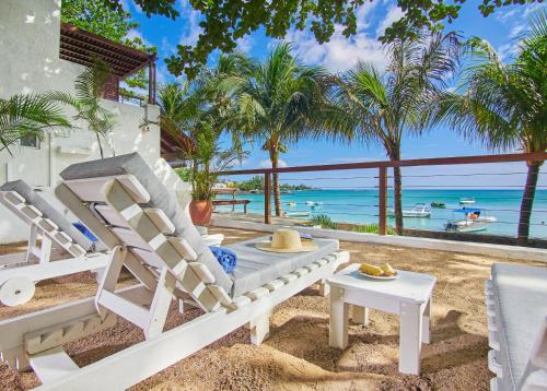 a beach house with a view of the ocean at Le Beachclub in Pereybere