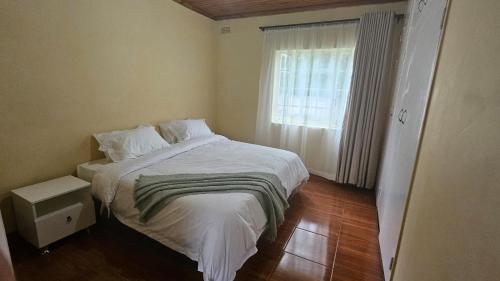 Postel nebo postele na pokoji v ubytování Dahlia