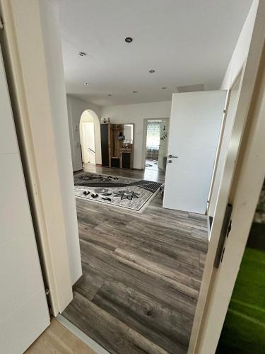 a hallway of a house with a white refrigerator at Casa del Retiro in Nebersdorf