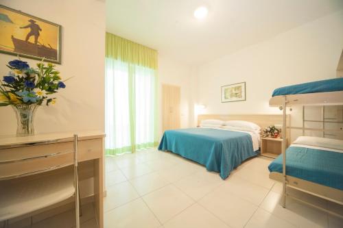 Postel nebo postele na pokoji v ubytování Hotel Lara