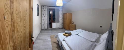 Posteľ alebo postele v izbe v ubytovaní Apartament KOMPAS