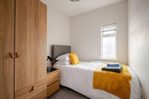 Ένα ή περισσότερα κρεβάτια σε δωμάτιο στο Ekaya Cozy Home