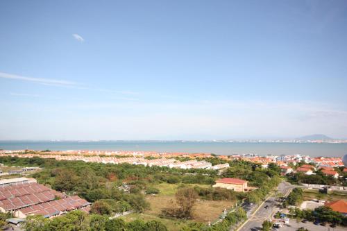 an aerial view of a city and the ocean at 118 Residences by Travovo in George Town