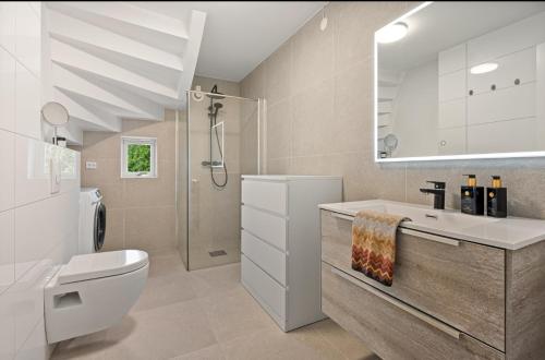 Koupelna v ubytování Koselig sentral leilighet