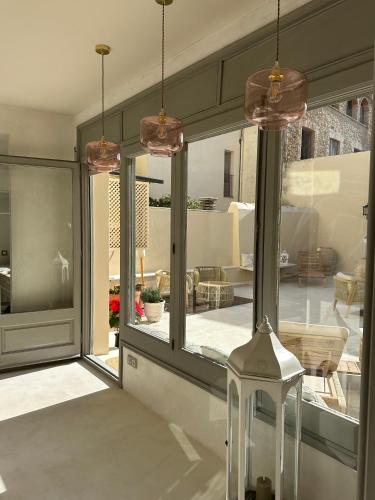 a room with a large glass window with a patio at C'Anne Marie in Palafrugell
