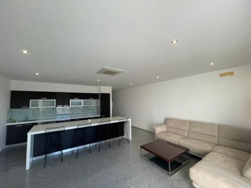 a living room with a couch and a table at Casa Klei in Ulcinj