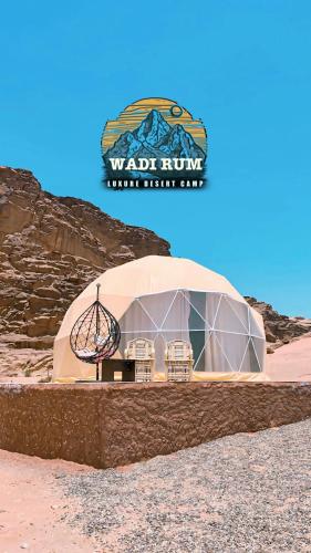 a dome building in the middle of the desert at Wadi Rum Luxure desert Camp in Wadi Rum