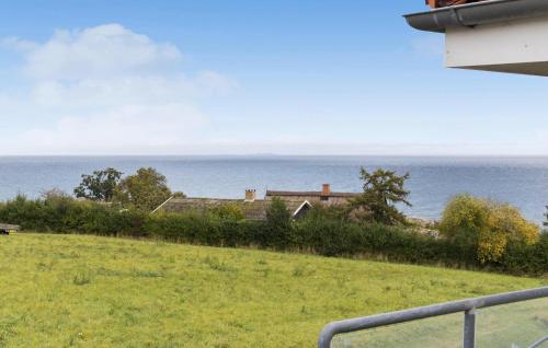 a view of the ocean from a house at Gudhjem Søpark Lejl 18 in Gudhjem