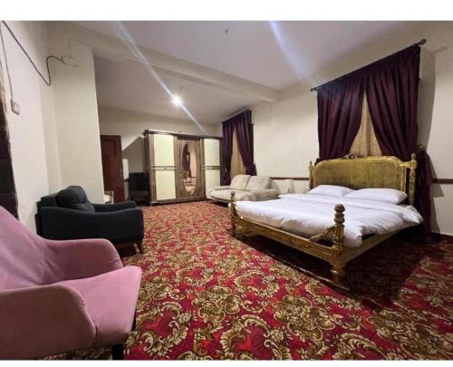 Postel nebo postele na pokoji v ubytování Cairo Hotel