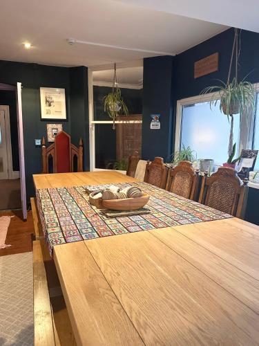 a wooden table with a pair of shoes on top at The Boho - 4 min walk to beach & town in Bournemouth