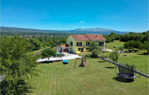 an aerial view of a house with a playground at 4 Bedroom Gorgeous Home In Hrvace in Hrvace