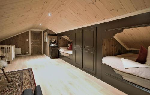 a room with two bunk beds in a attic at Amazing Home In Gålå With Sauna in Gålå