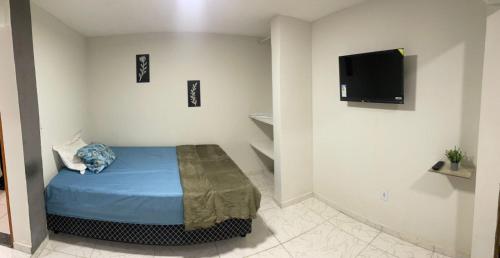 En eller flere senge i et værelse på Suíte 4 Caminho do Mirante