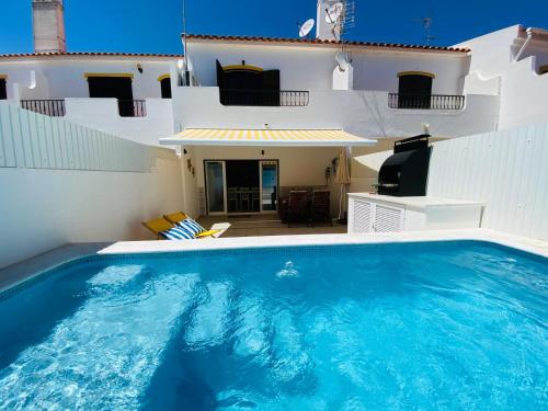 a large swimming pool in front of a house at StaySalty - Resort Style Family Beach House with Pool in Altura