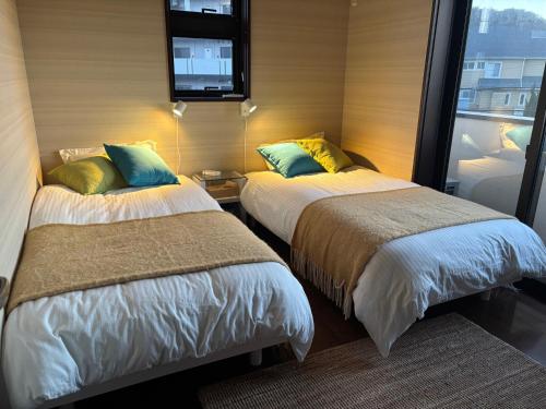 Postel nebo postele na pokoji v ubytování Cielito Hayama