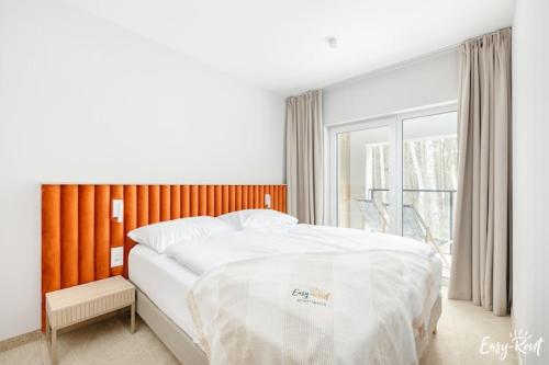 Ένα ή περισσότερα κρεβάτια σε δωμάτιο στο Apartment uk cin near Beach and Pool