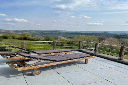 a wooden cart sitting on top of a patio at Spacious Villa with Sauna in Érezée