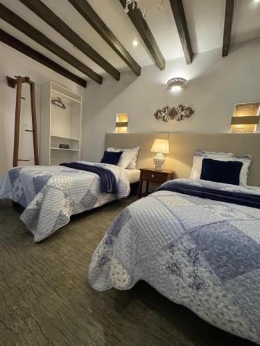 Letto o letti in una camera di Santa Lucía Casa Hotel