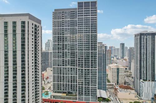 a view of a tall building in a city at Stunning Lux 2 Bed 2 Bath with Panoramic View from Balcony in Miami