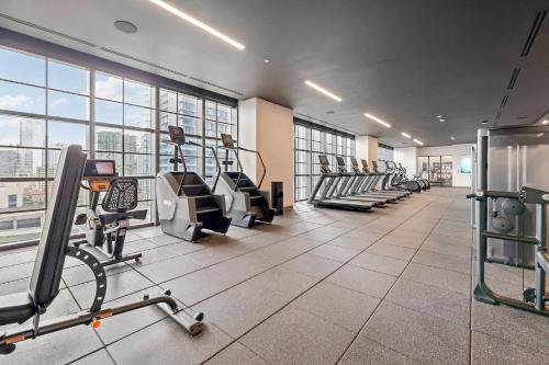 a gym with treadmills and machines in a building at Stunning Lux 2 Bed 2 Bath with Panoramic View from Balcony in Miami