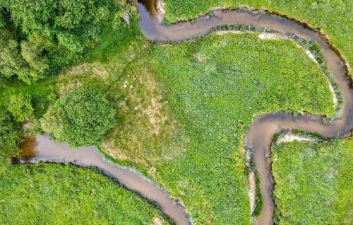 an aerial view of a river in the grass at 5 Bedroom Pet Friendly Home In Nibe in Nibe