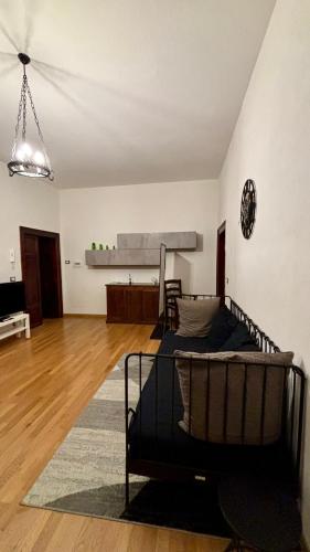 a bedroom with a bed and a living room at Casa del Conte in Canino