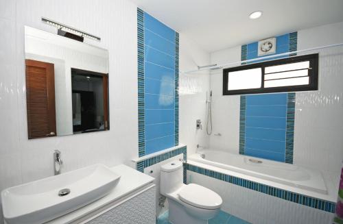 a bathroom with a toilet and a sink and a tub at Baan Ping Tara Private Pool Villa in Ao Nang Beach