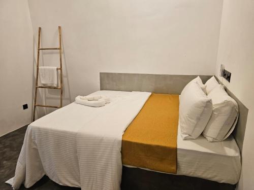 a bedroom with a large bed with a ladder at Muthu Hiriketiya in Dickwella