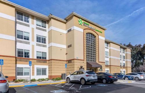 a car parked in a parking lot in front of a hotel at Extended Stay America Premier Suites - San Jose - Airport in San Jose