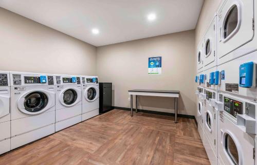 a laundry room with washing machines and a table at Extended Stay America Premier Suites - San Jose - Airport in San Jose