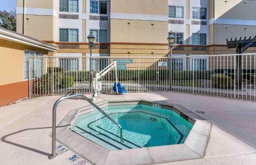 a swimming pool with a water slide in a building at Extended Stay America Premier Suites - San Jose - Airport in San Jose