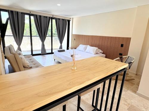 a hotel room with a bed and a table at Apartment in Coveñas FOREST in Coveñas