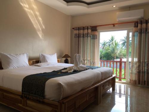Katil atau katil-katil dalam bilik di Leego Hotel