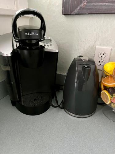 a coffee maker and a toaster on a counter at Cozy Portland Retreat in the Heart of Hollywood in Portland