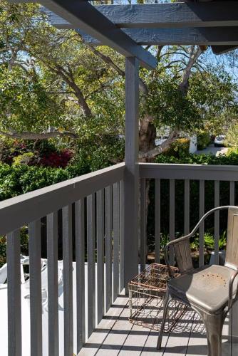 a porch with a chair and a table and aearcher at Montecito-Chic Beachside Retreat in Montecito