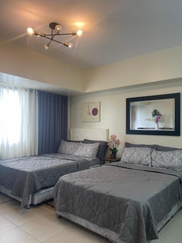 Giường trong phòng chung tại Affordable Tagaytay Serin East Staycation