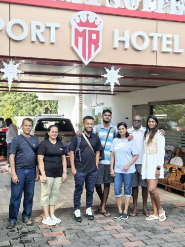 a group of people standing in front of a hotel at MARINA SUITES AIRPORT HOTEL in Cochin