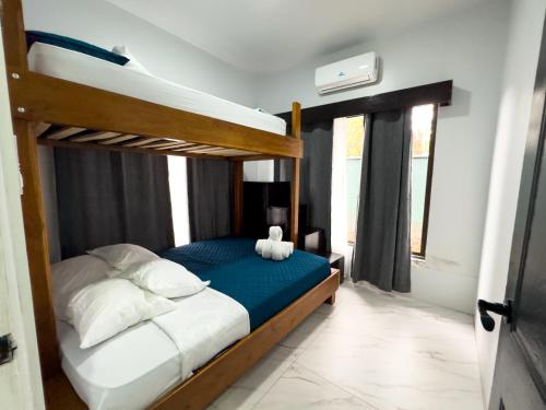 Postel nebo postele na pokoji v ubytování MaBri Arenal Home
